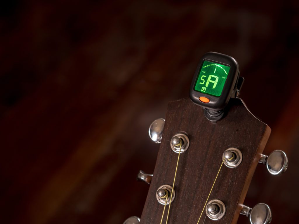clip on guitar tuner on headstock